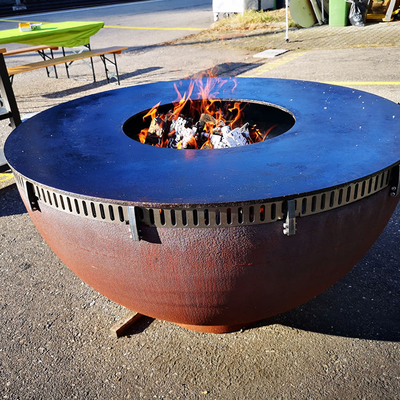 OEM ODM الطبخ في الهواء الطلق الشوايات Corten Steel Ring Bbq Fire Pit with Log Store